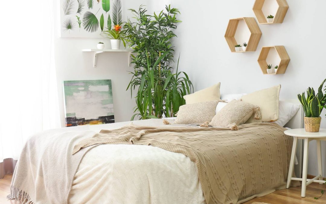 Stylish bedroom oasis with a floor bed, wooden accents, and plenty of plant life for a serene slumber.